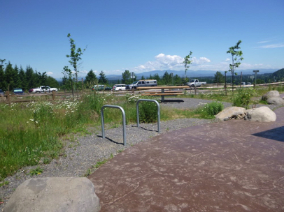 Accessible picnic bench and bike racks near the Visitor Center